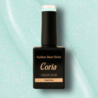 Baza Rubber Shiny Coria 752023, flacon 15 ml pe fundal bleu sclipitor