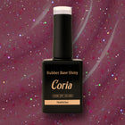 Baza Rubber Shiny Coria 332023, flacon 15 ml pe fundal vișiniu sclipitor