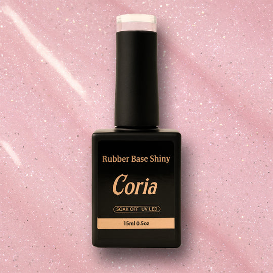 Baza Rubber Shiny Coria 802023 15 ml – flacon negru pe fundal roz sclipitor