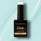 Baza Rubber Shiny Coria 732023, flacon 15 ml pe textură bleu cu sclipici
