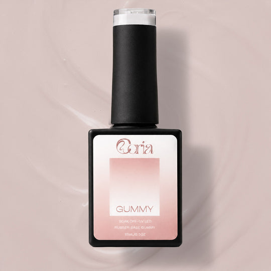 Baza Rubber Gummy Nude 115 Coria, flacon 15 ml pe fundal roz-bej