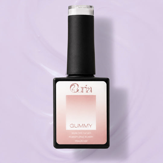 Baza Rubber Gummy Nude 120 Coria, flacon 15 ml pe fundal lila pal