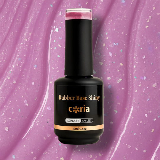 Baza Rubber Shiny Coria 033 Milky Pink, flacon 15 ml pe fundal roz cu sclipici