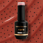 Baza Rubber Shiny 105 Coria, flacon 15 ml pe fundal cărămiziu cu buline negre