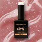 Baza Rubber Shiny Coria 462023, flacon 15 ml pe fundal roz cu fulgi