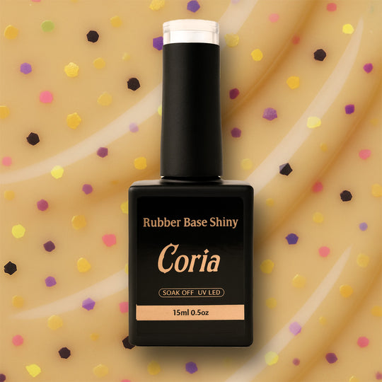Baza Rubber Shiny Coria 572023, flacon 15 ml pe fundal crem cu buline colorate