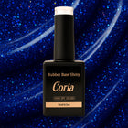 Baza Rubber Shiny Coria 622023, flacon 15 ml pe fundal albastru cu sclipici