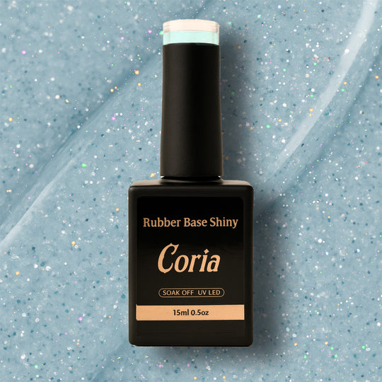 Baza Rubber Shiny Coria 902023, flacon 15 ml pe fundal bleu sclipitor