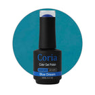 Ojă semipermanentă Coria Blue Dream 15, flacon 15 ml pe fundal albastru-petrol
