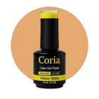 Ojă semipermanentă Coria Yellow Vibes 03, flacon 15 ml pe fundal portocaliu pal