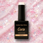 Bază rubber Shiny Coria 1002023 15 ml, pe fundal roz cu paiete